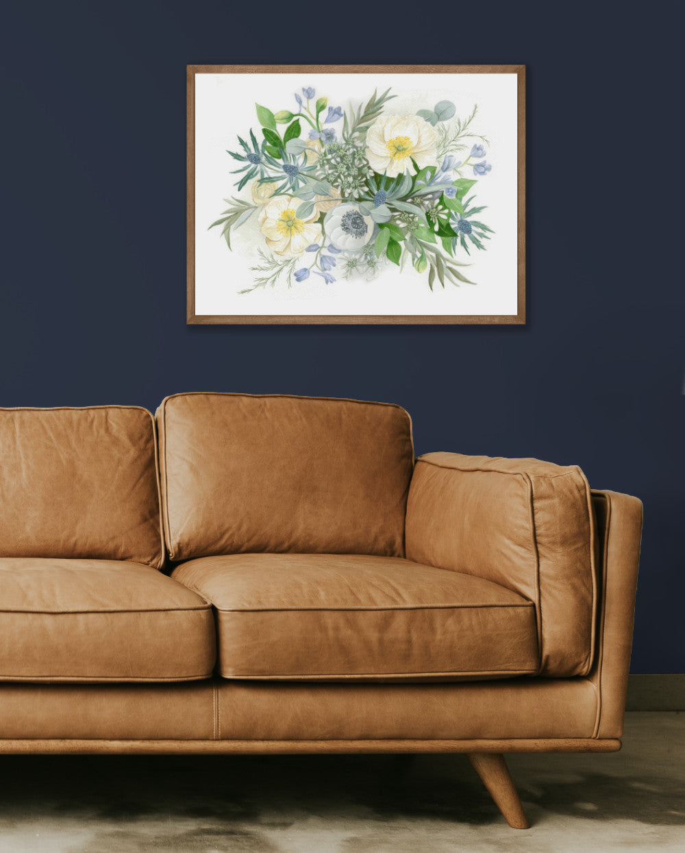 blue bouquet painting on dark blue wall with brown couch
